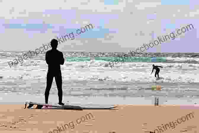 A Group Of Surfers Sitting On The Beach, Watching The Waves Barbarian Days: A Surfing Life