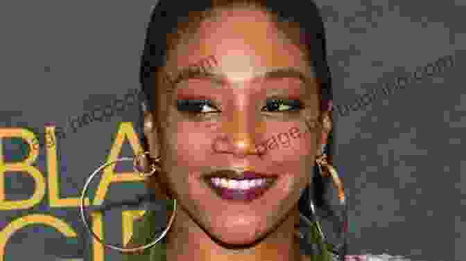 Smiling Tiffany Haddish Holding Her Book, 'Once Upon An Hour' Once Upon An Hour Tiffany Haddish
